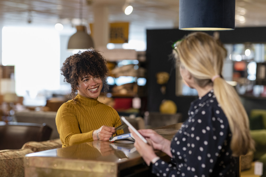 woman paying for items with a credit card