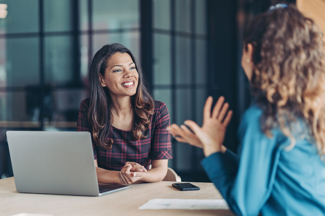two women discussing payment processing partners