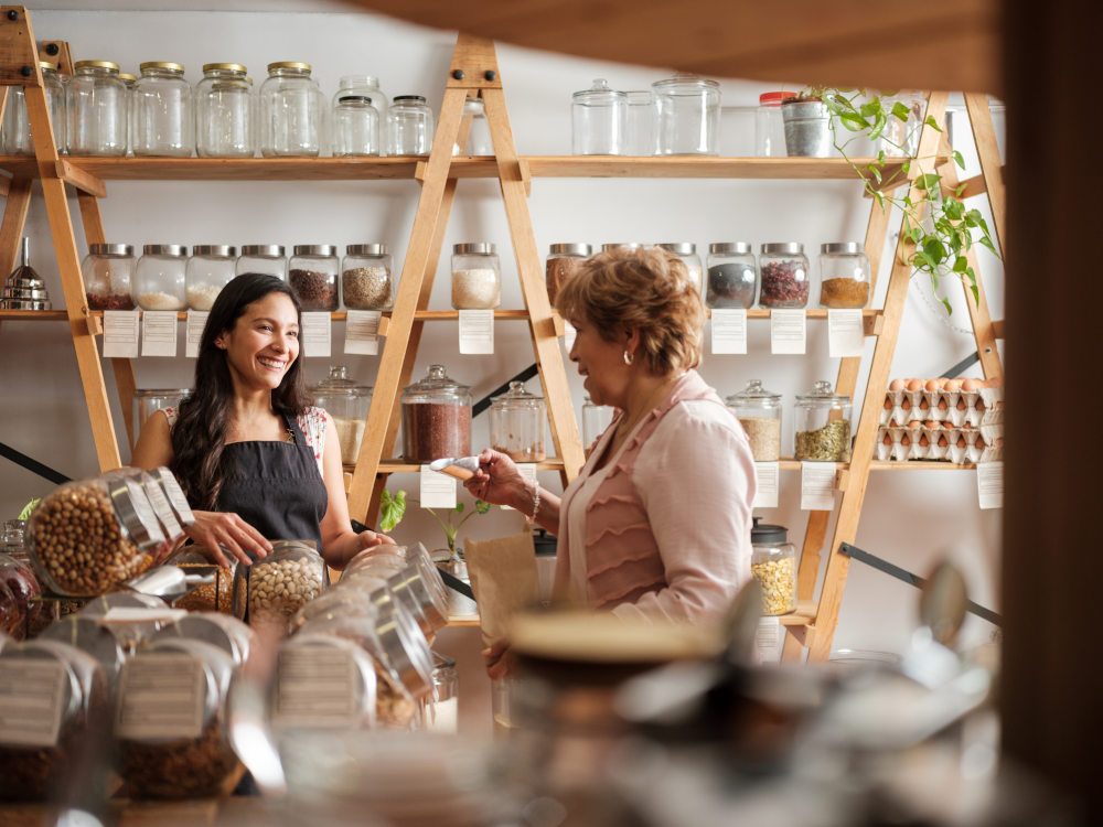 a female shop owner speaking to customer