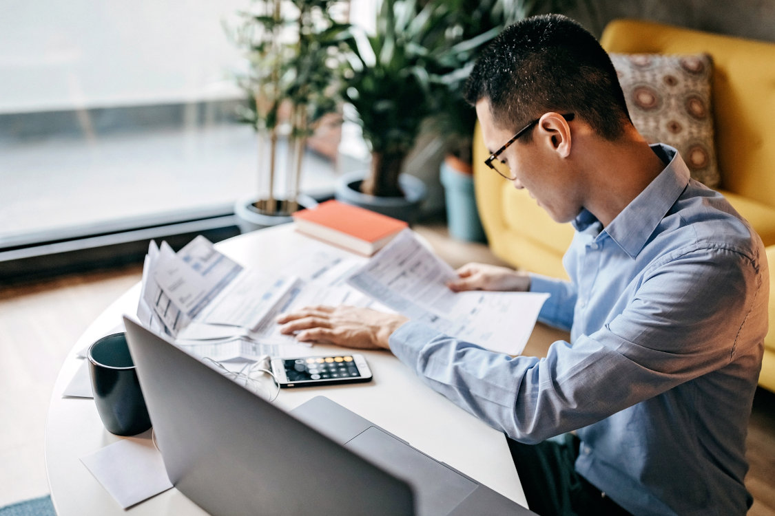 man reviewing financial statements