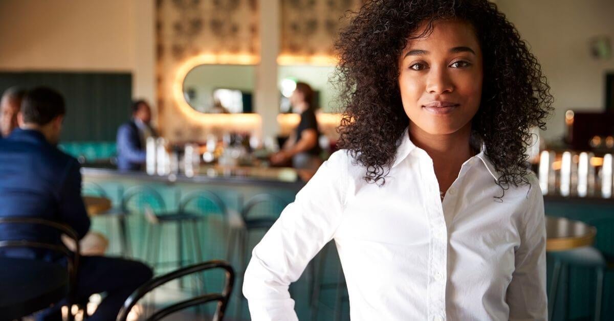 providence-ri-pos-dealer-standing-in-her-clients-restaurant