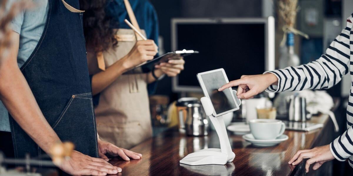 north-valley-nm-point-of-sale-dealer-showing-her-clients-how-to-use-the-pos-system