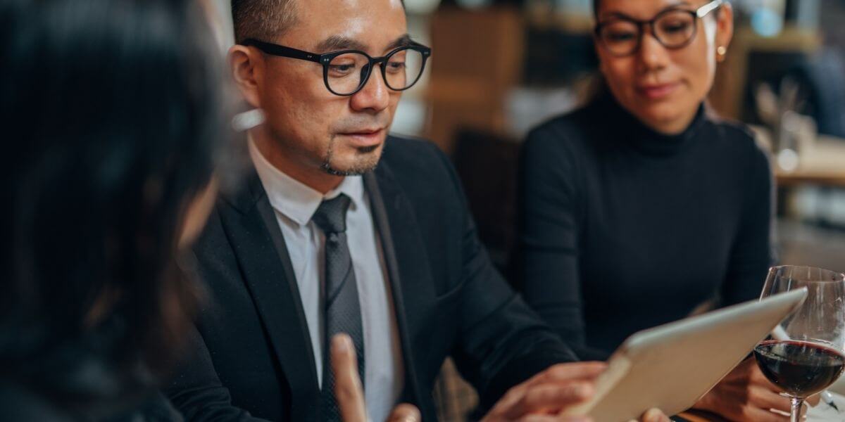 a-pos-dealer-in-shirley-ma-showing-his-merchant-the-benefits-of-total-touch