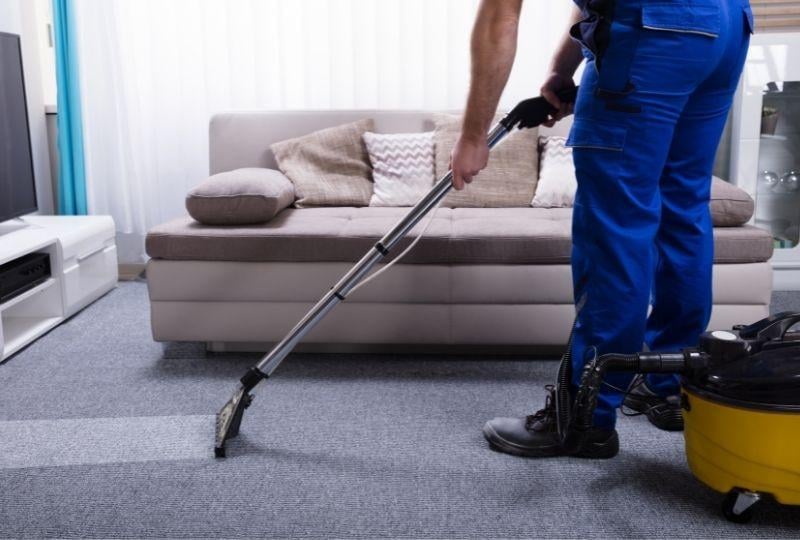 a-technician-professionally-steaming-and-cleaning-a-carpet