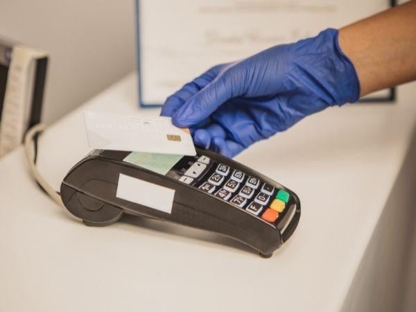 dental patient paying with a credit card