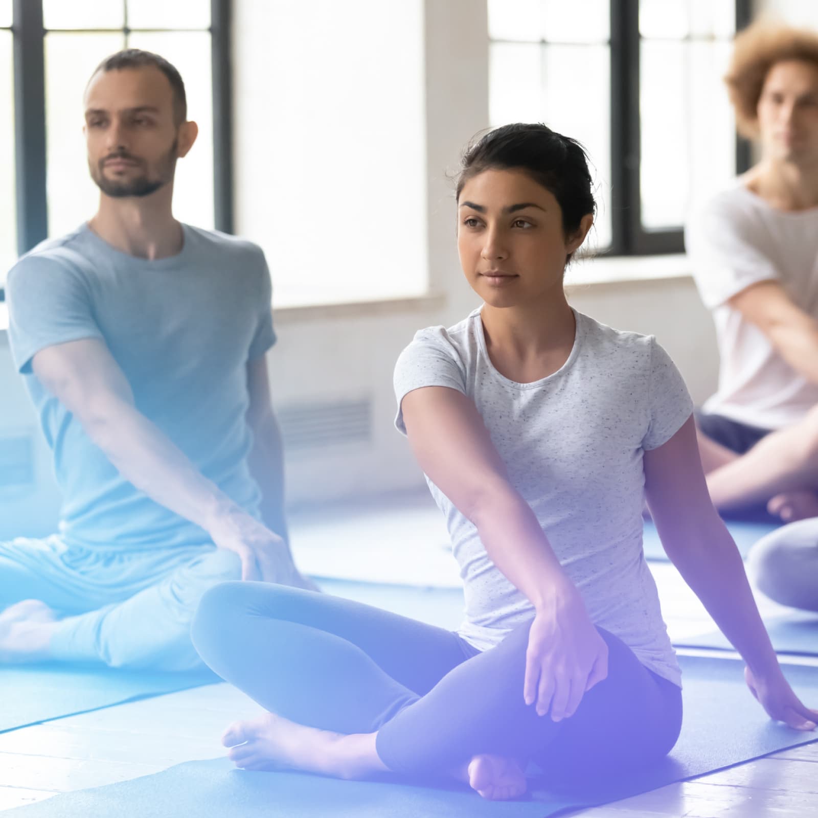 Woman and man sitting in Yoga class