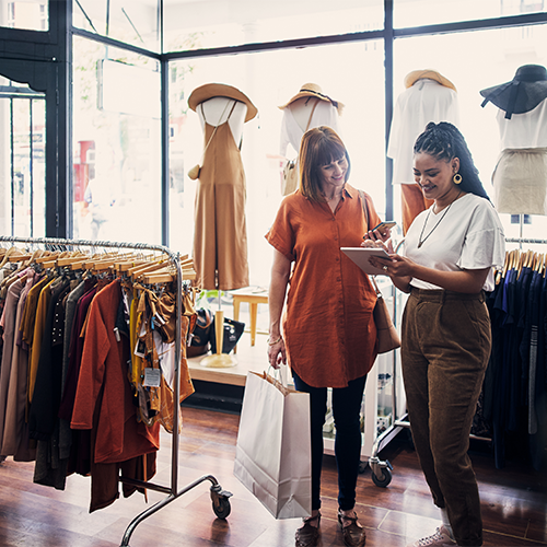 Retail shop with customers processing payments