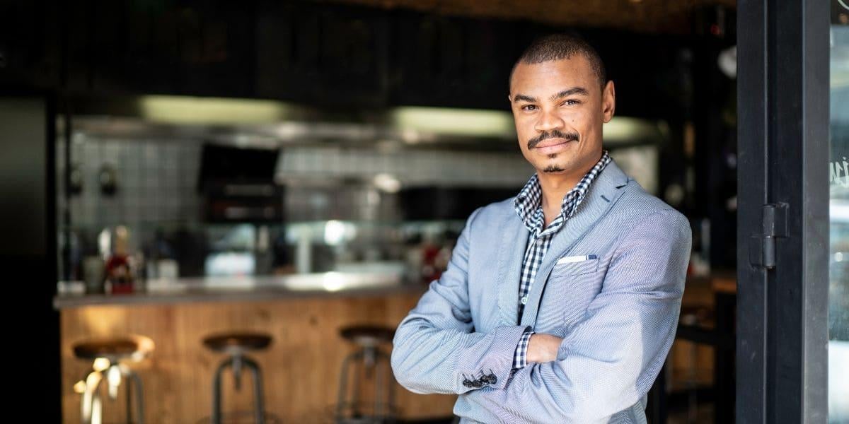 a-pos-reseller-standing-in-his-clients-restaurant