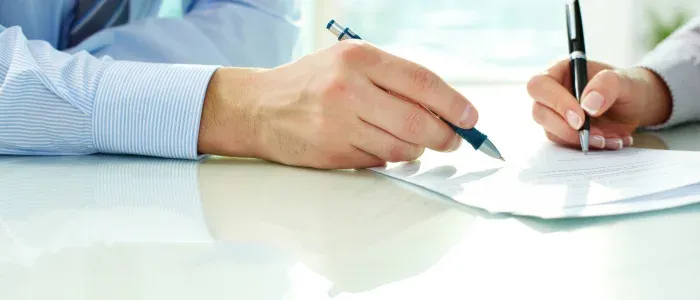 A person signing a merchant agreement.